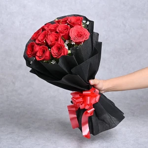 Red Roses In Black Sheet