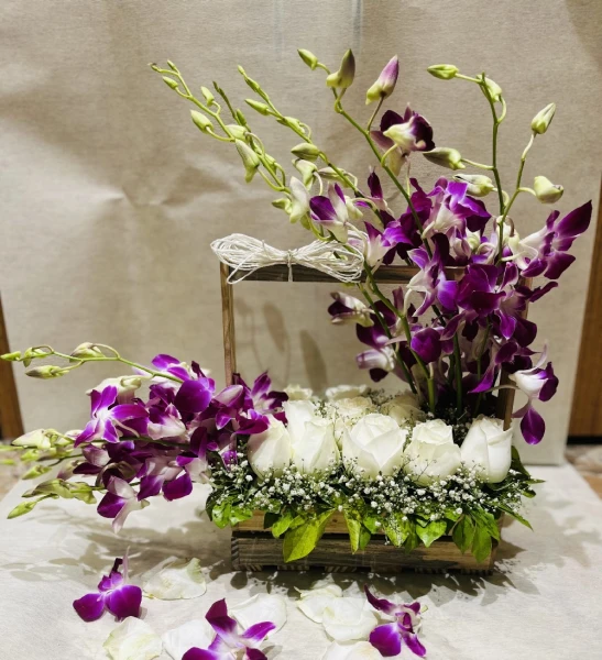 Perfect Basket Arrangment Of Orchids And White Roses